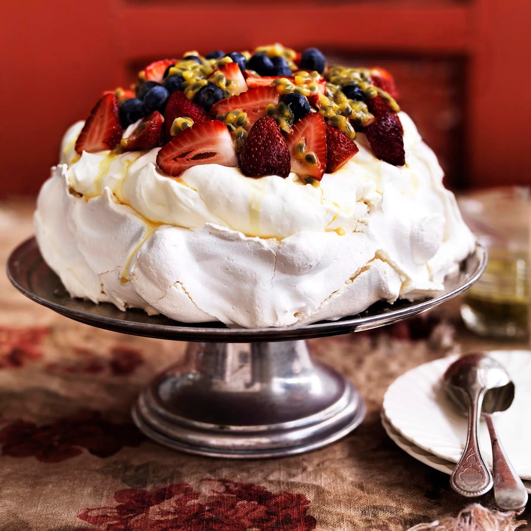  berry pavlova on a cake stand